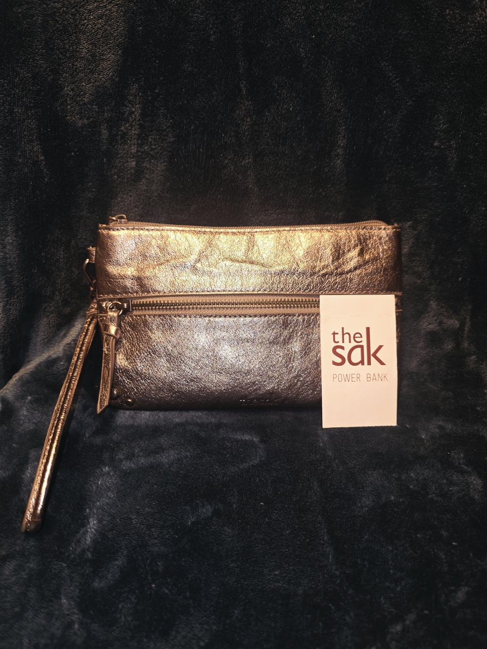 The Sak Metallic Gold Leather Wristlet Power Clutch (with charger and cords)
